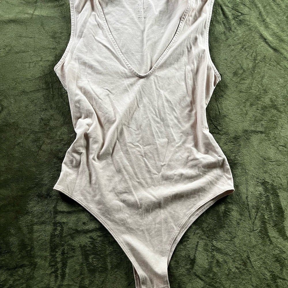 Cream Sleeveless Cut Out Bodysuit